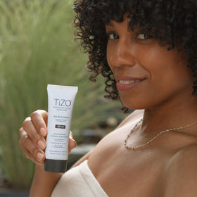 TIZO label detail highlighting ceramides, antioxidants, and mineral filters