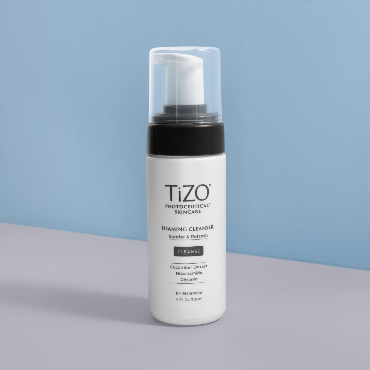 TIZO cleanser in hand being lathered on damp skin, shows easy application and comfort