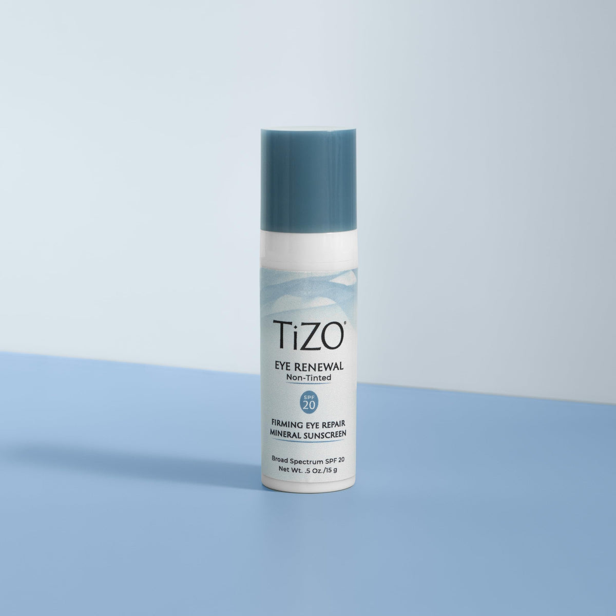 TIZO next to everyday objects showing 0.5 oz size for portability benefit