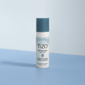 TIZO next to everyday objects showing 0.5 oz size for portability benefit