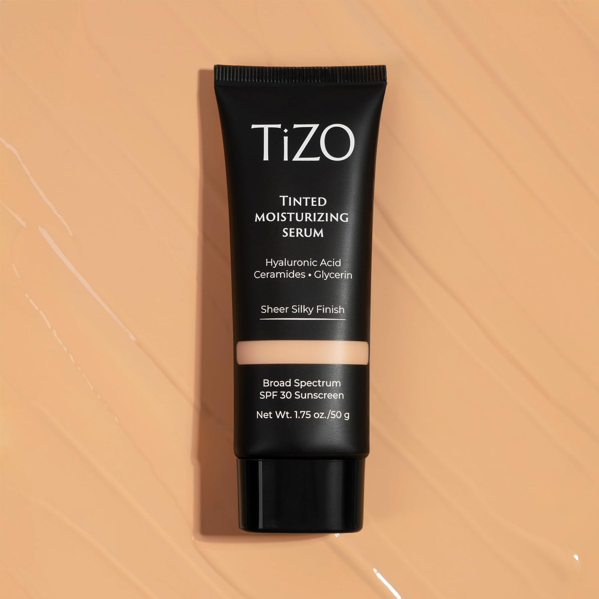 TIZO tube next to sunglasses indicating travel size convenience and sun protection