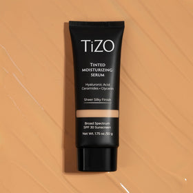 TIZO bottle shown next to common items illustrating portable size and daily convenience