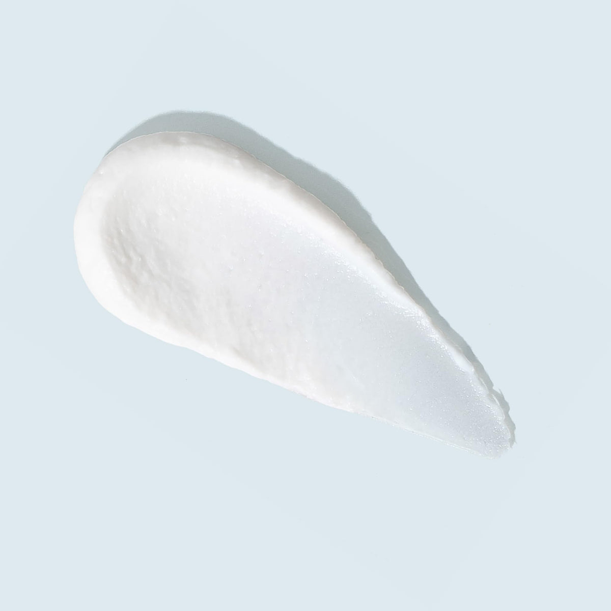 TIZO creamy-sheer texture close-up illustrating lightweight matte finish
