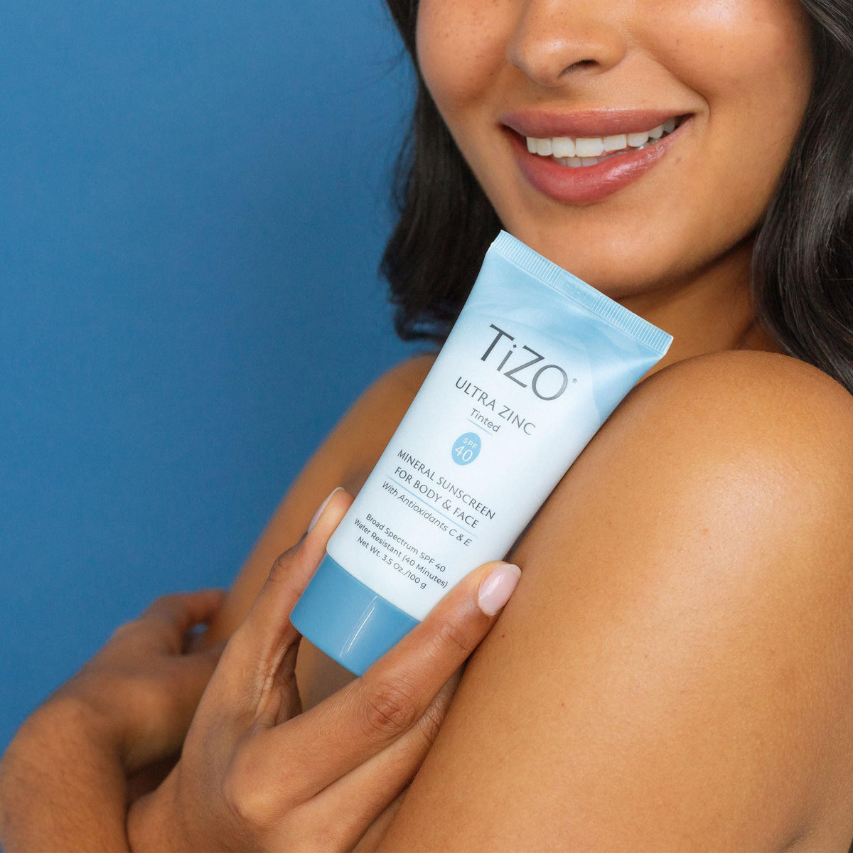 TIZO tube on bathroom vanity suggesting daily skincare routine
