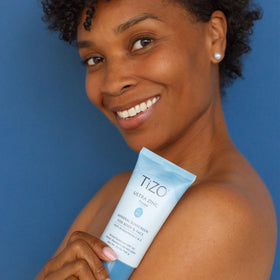 TIZO tinted sunscreen swatched on arm showing blendable coverage