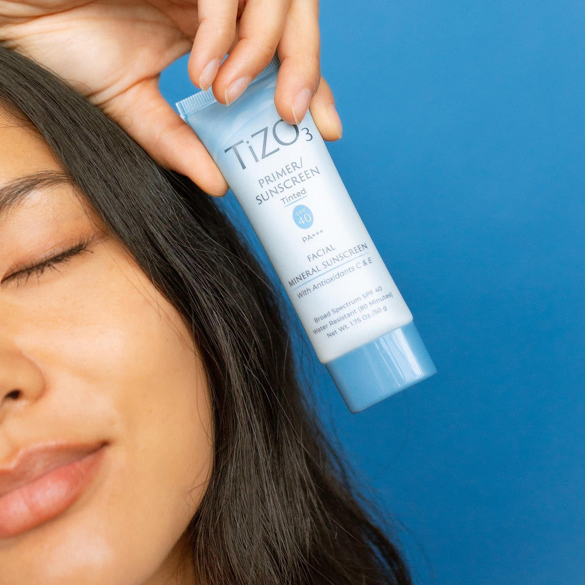 TIZO application on hand demonstrating blendable tinted coverage and quick absorption