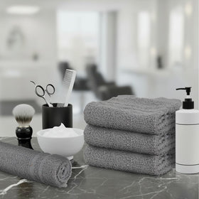 TOALLA towel held in hand demonstrating compact size and easy grip