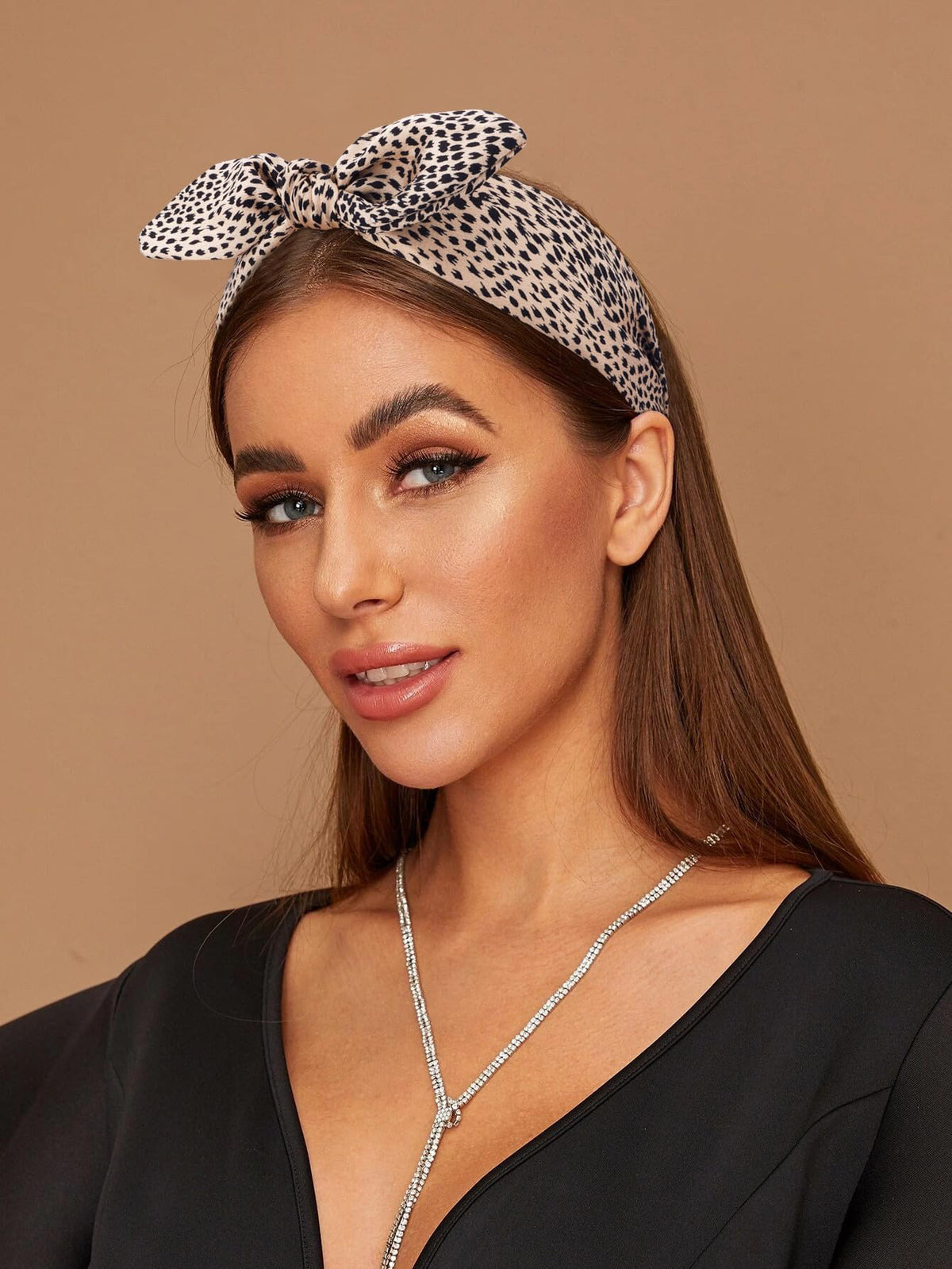 TOBATOBA model wearing cheetah bow showing stylish everyday benefit