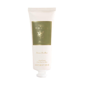 tocca Florence open tube on palm, brand demonstrating quick absorption benefit