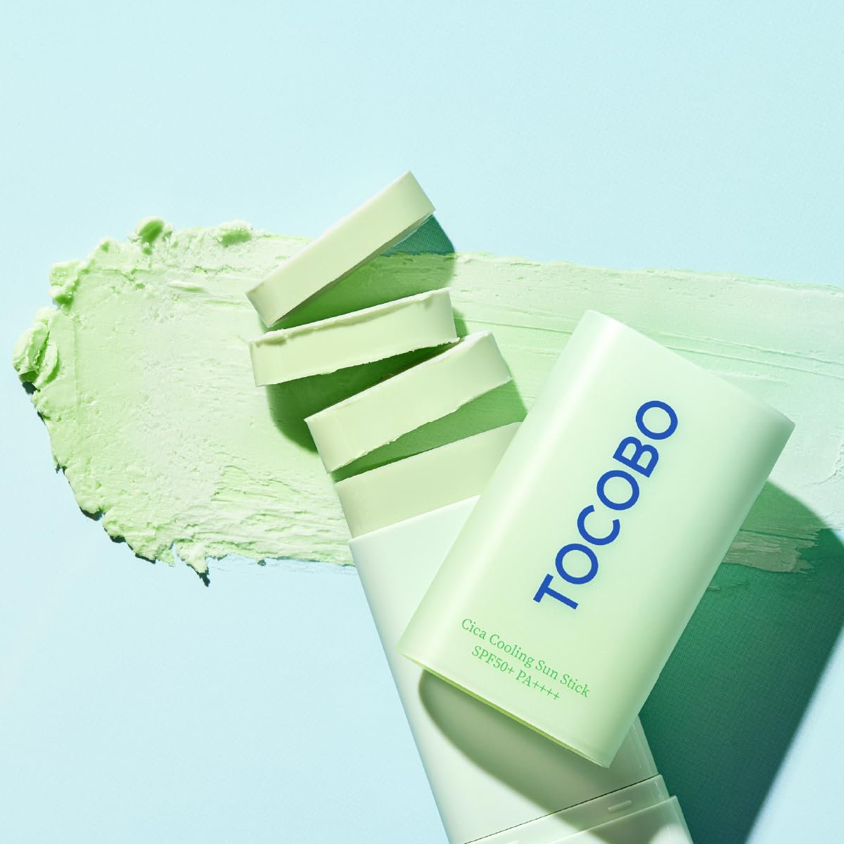 TOCOBO applying sun stick to cheek demonstrating quick, mess-free coverage