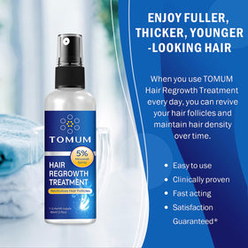 TOMUM bottle held in hand to show size and travel-friendly benefit