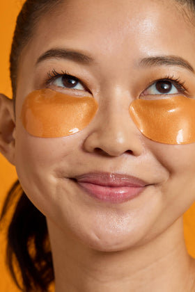 TONYMOLY patches applied under eyes demonstrating cooling effect