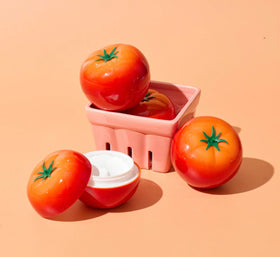 TONYMOLY open tube revealing tomato-colored product and natural ingredients
