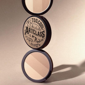 Too Cool For School compact next to coin showing compact size for travel