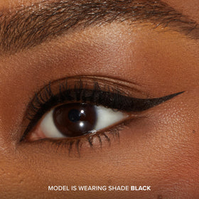 Too Faced eyeliner in use creating a sharp wing for lasting definition