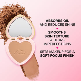 Too Faced powder applied on model near mirror for natural matte look