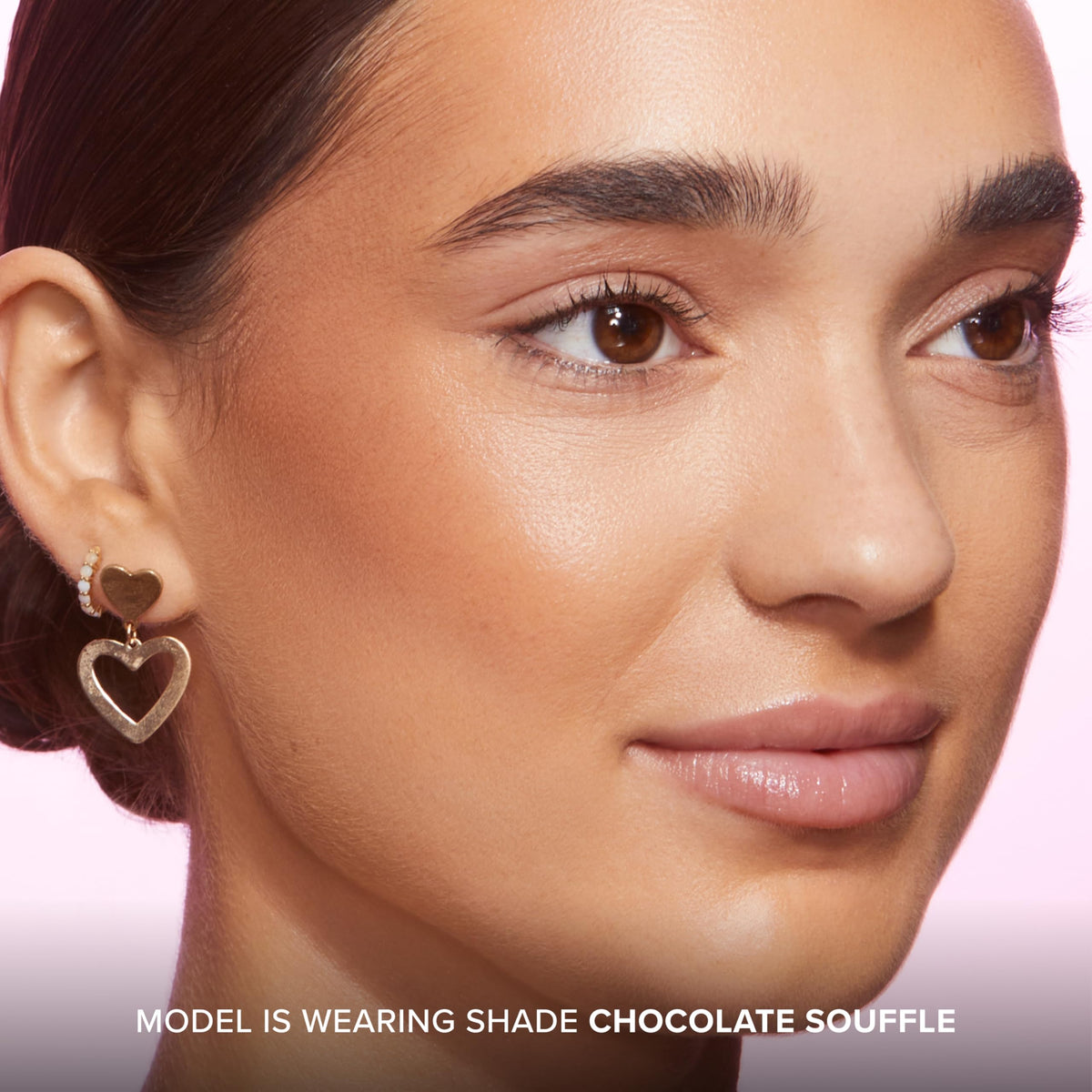 Too Faced model applying Chocolate Soleil on cheek for natural sculpting and warmth
