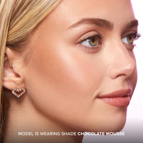 Too Faced Chocolate Soleil blended swatch on cheek showing natural sun-kissed warmth benefit