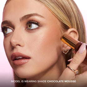 Too Faced Chocolate Soleil retail packaging staged in a lifestyle scene showing gift-ready appeal benefit