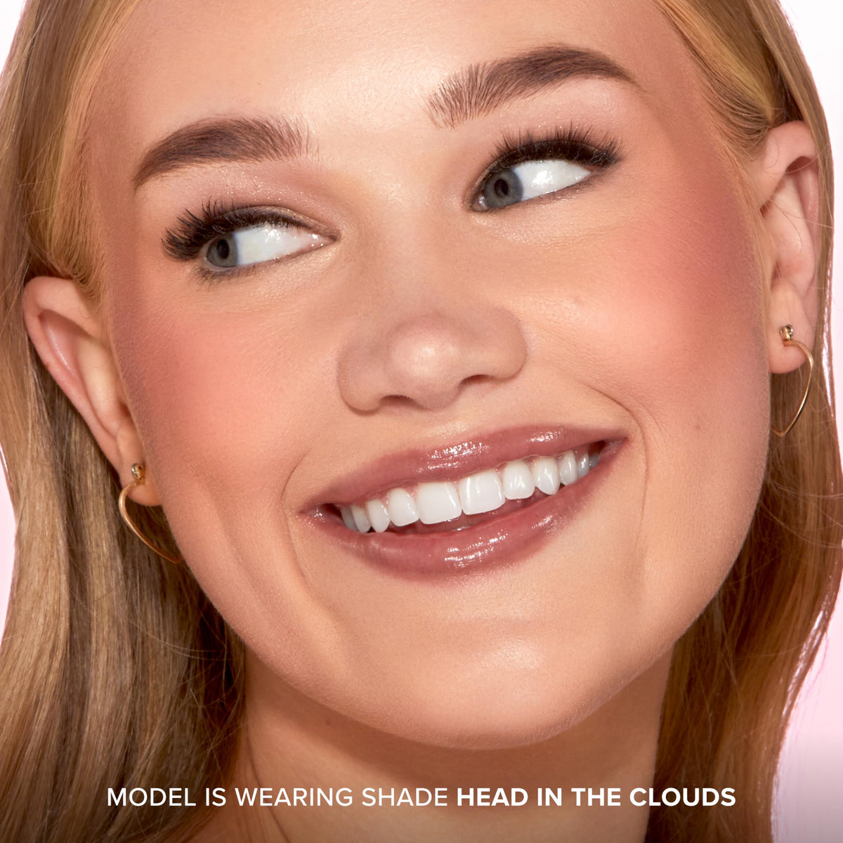 Too Faced blush being swiped with a brush showing buildable pigment