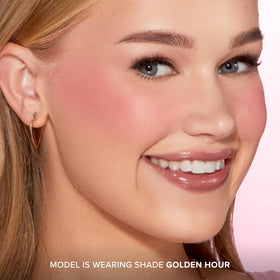 Too Faced compact open with brush showing ease of application and travel-friendly benefit