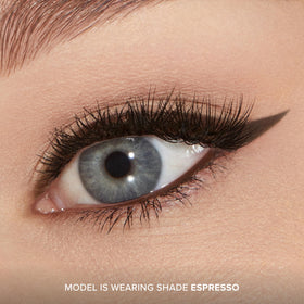 Too Faced liner applied in a winged eye look highlighting long-lasting definition