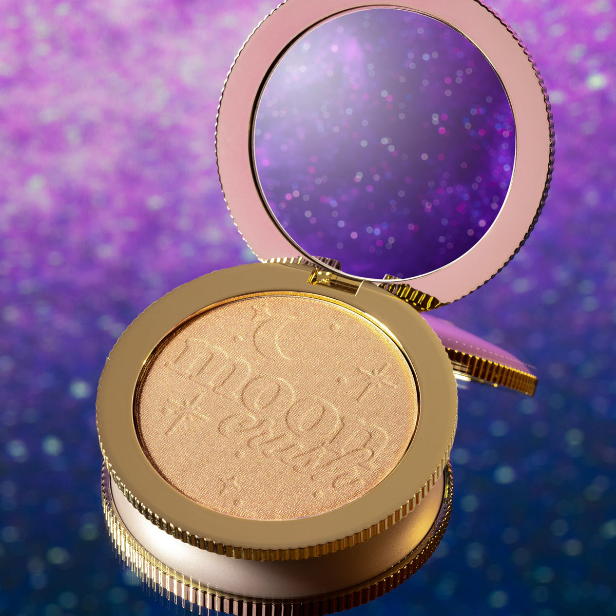 Too Faced applying with brush demonstrating buildable, blendable glow
