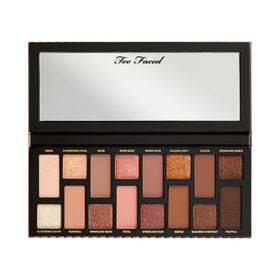 Too Faced palette held in hand showing compact size and travel-friendly convenience
