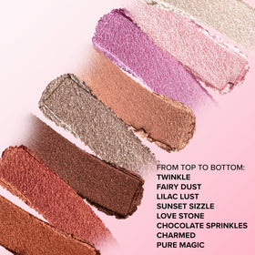 Too Faced stick next to standard lipstick showing compact travel-friendly size