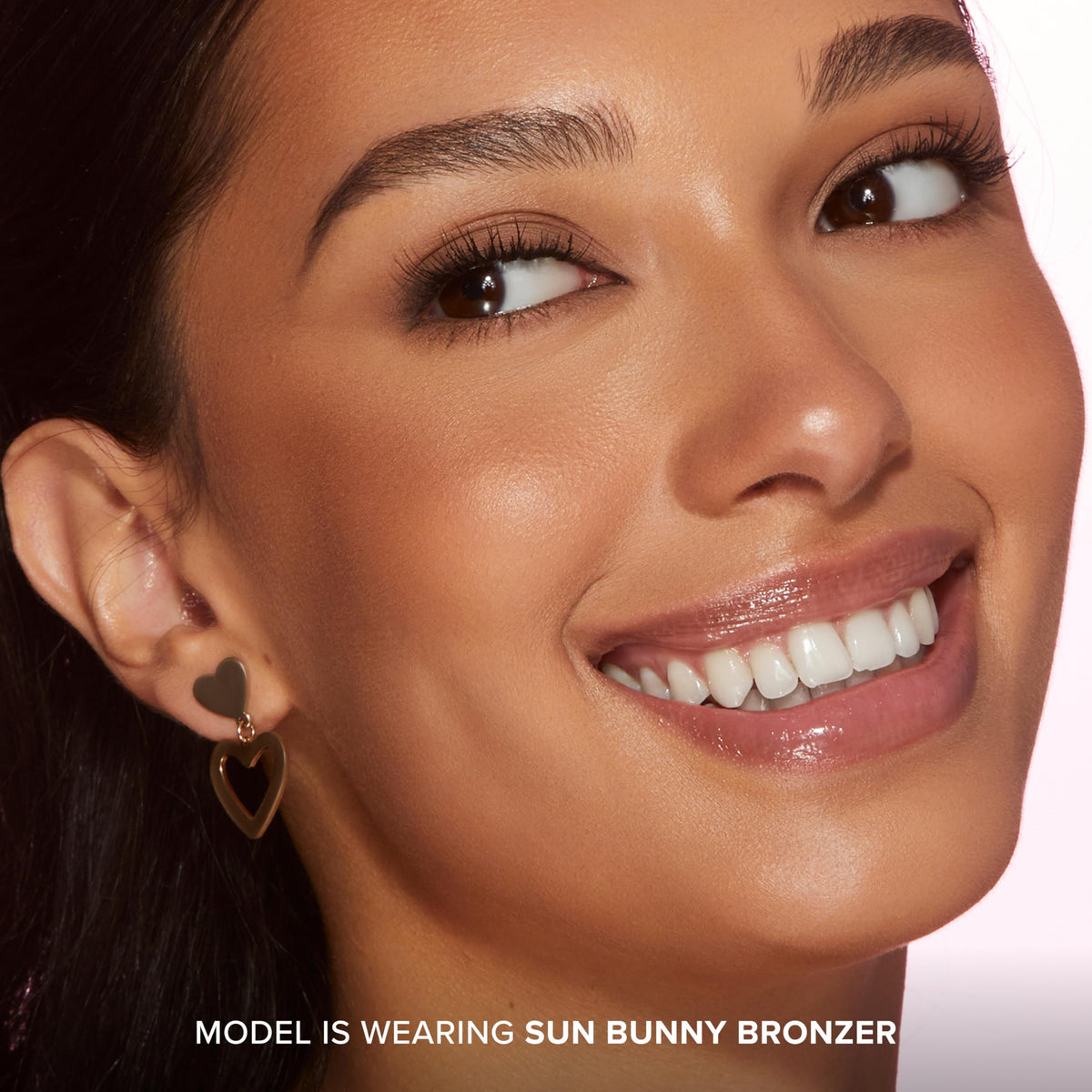 Too Faced Sun Bunny applied on cheek to illustrate natural sun-kissed glow