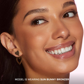 Too Faced Sun Bunny applied on cheek to illustrate natural sun-kissed glow