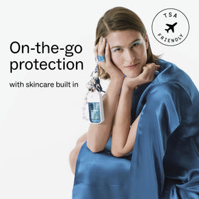 Touchland spray being applied to hands indicating fast-drying protection