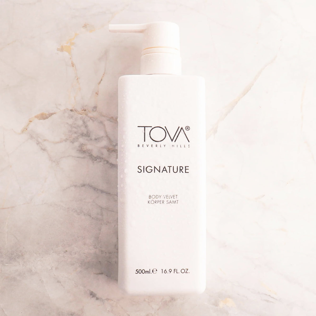 Tova lotion texture close-up highlighting silky shea butter finish and hydration