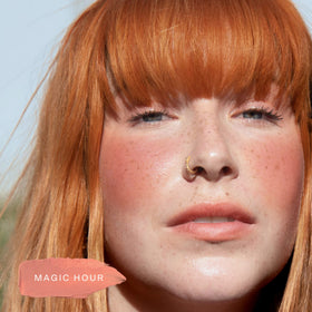 Tower 28 lip swatch rosy nude on lips delivering subtle juicy tint