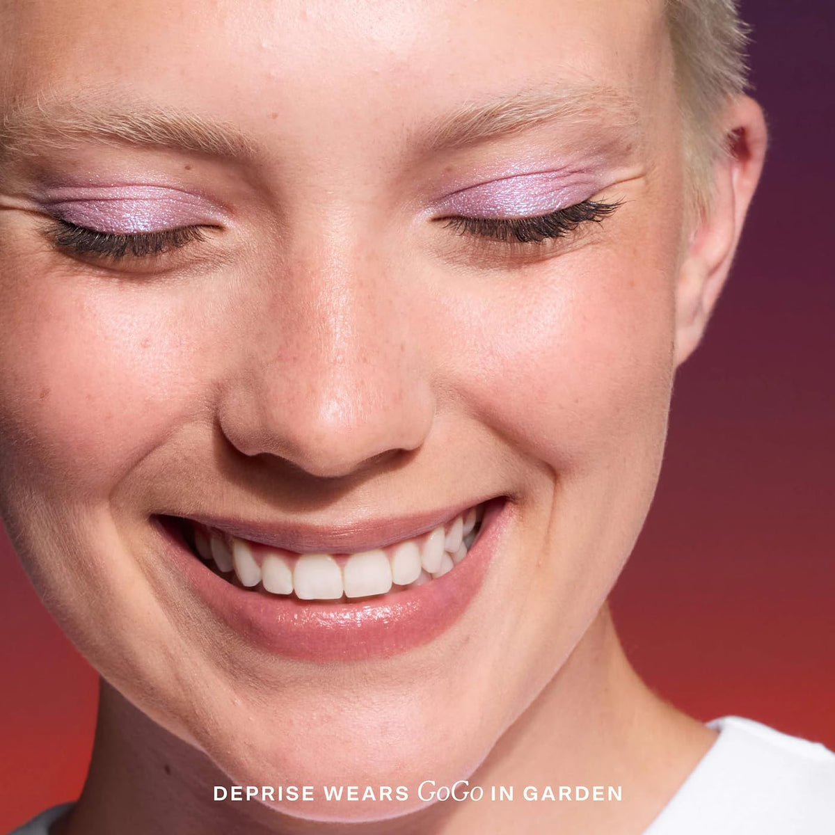 Tower 28 full eye look showing bold purple shimmer and long wear