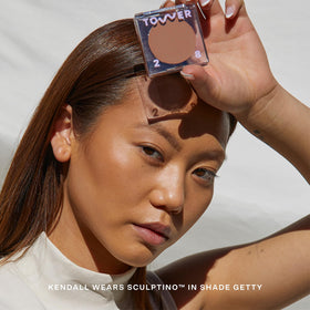 Tower 28 applying sculptino along cheek to create natural contour benefit