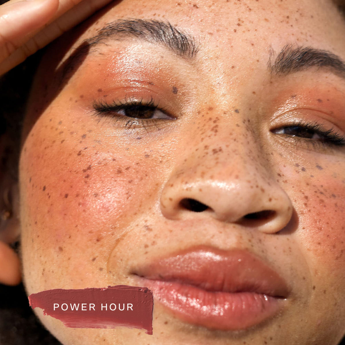 Tower 28 BeachPlease tinted lip balm on lips with a juicy, hydrating finish