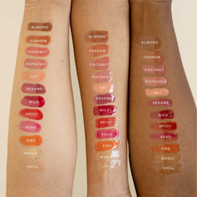 Tower 28 ShineOn on model lips illustrating sheer pink XOXO and dewy enhancement benefit