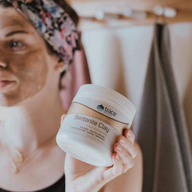 Trace Minerals jar beside towels in bath setting suggesting calming self-care