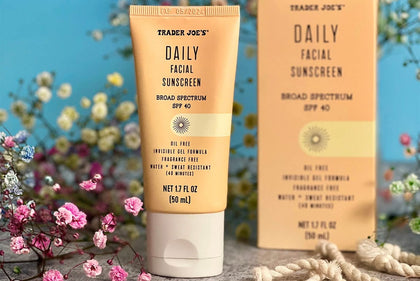 Trader Joe's Fair Trade facial sunscreen front packaging showing tube and SPF benefits