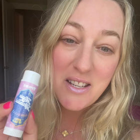 TREAT hand holding jumbo balm to show size and convenience for longer use