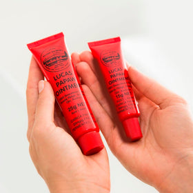Treats from Home applying ointment to lips demonstrating quick relief