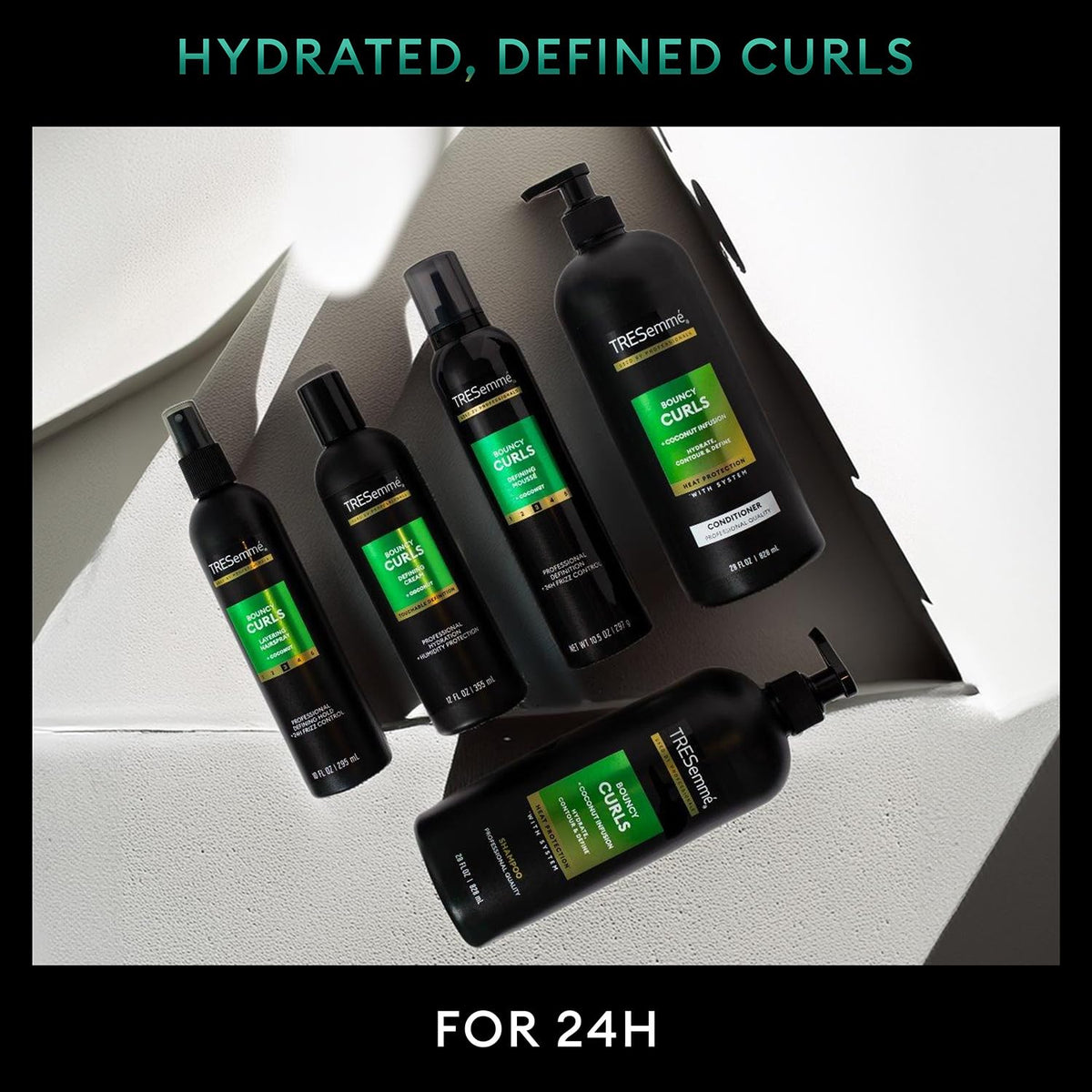 TRESemmé on a model with bouncy curls showing defined results