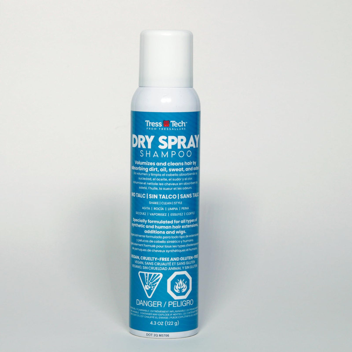 Tressallure spray being applied to a wig to add definition and volume