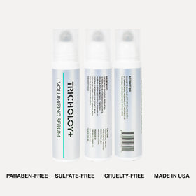 Tricholoy+ bottle next to hand to show compact travel-friendly 0.75 fl oz size