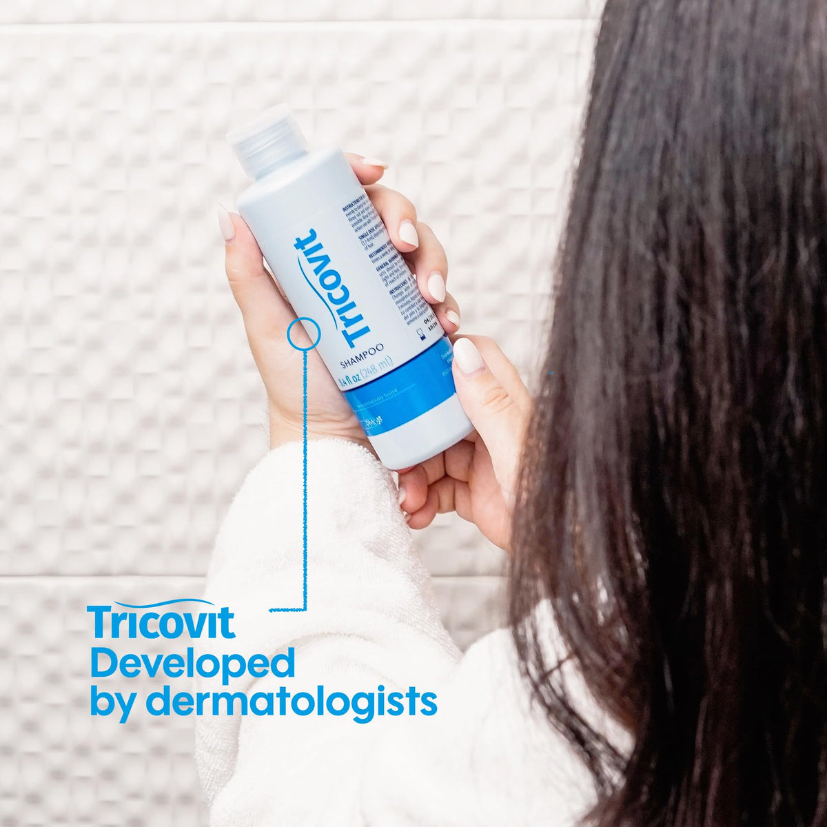 Tricovit being massaged into scalp to improve circulation and comfort