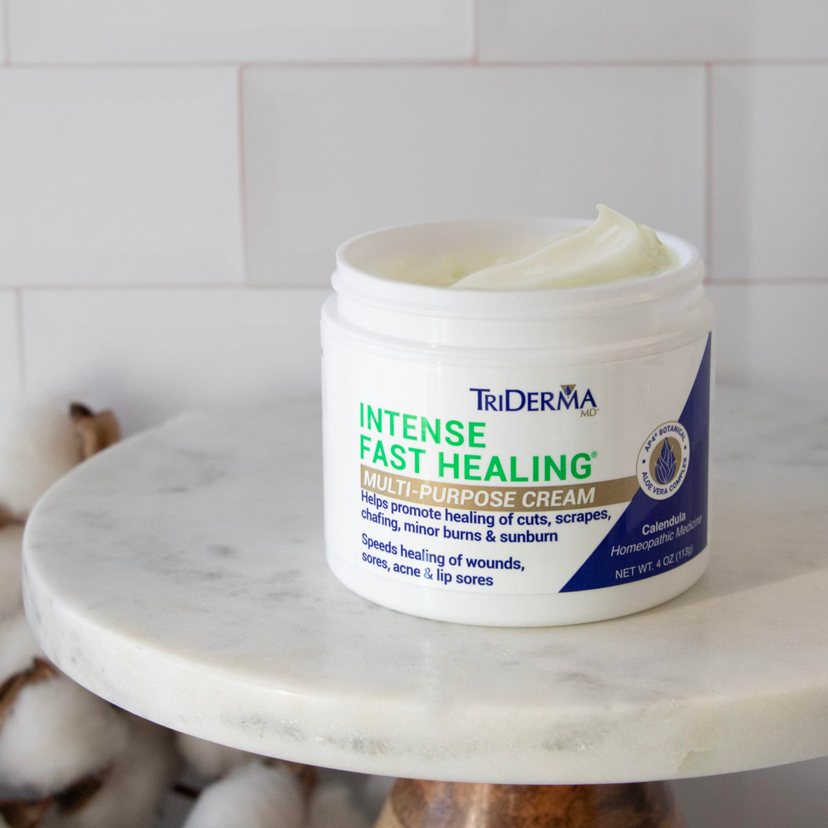 TriDerma ingredient display with aloe and botanicals emphasizing soothing properties
