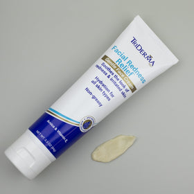 TriDerma lifestyle scene woman applying cream at mirror to soothe redness