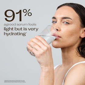 Trilogy serum being applied to cheek, demonstrating hydration and smoothing benefit