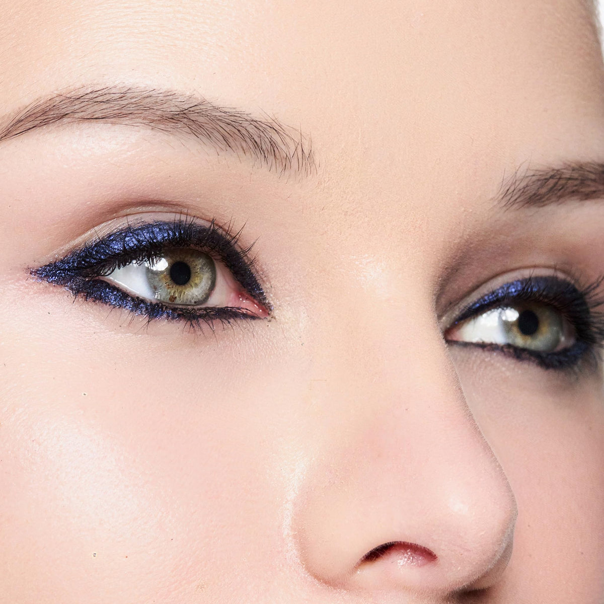 Trish McEvoy model applying gel liner at lash line, shows precision and control